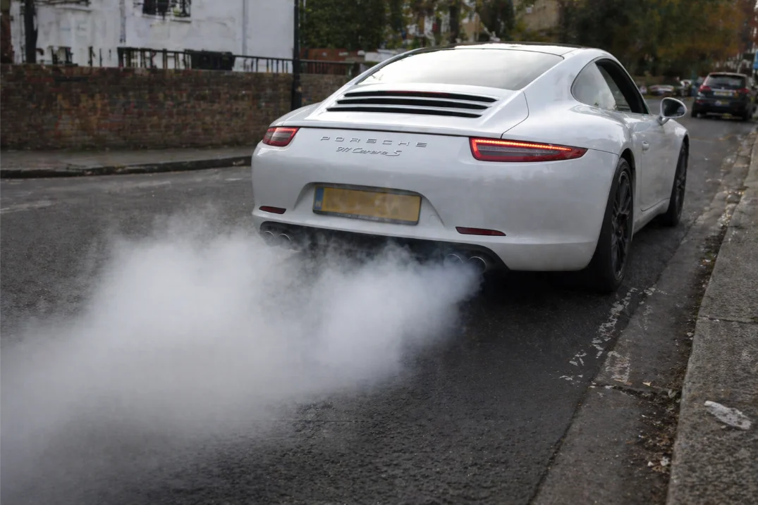 White Porsche excessive smoke from exhaust