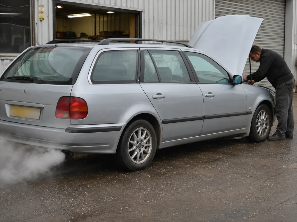 Engine overheating and white smoke warning signs on a vehicle in Crawley