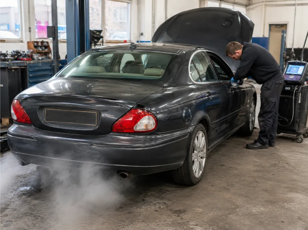 Engine overheating and white smoke warning signs on a vehicle in Northampton
